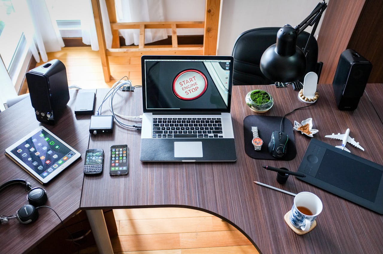 about-01 A contemporary office desk setup with laptops, gadgets, and accessories, creating a tech-savvy workplace.